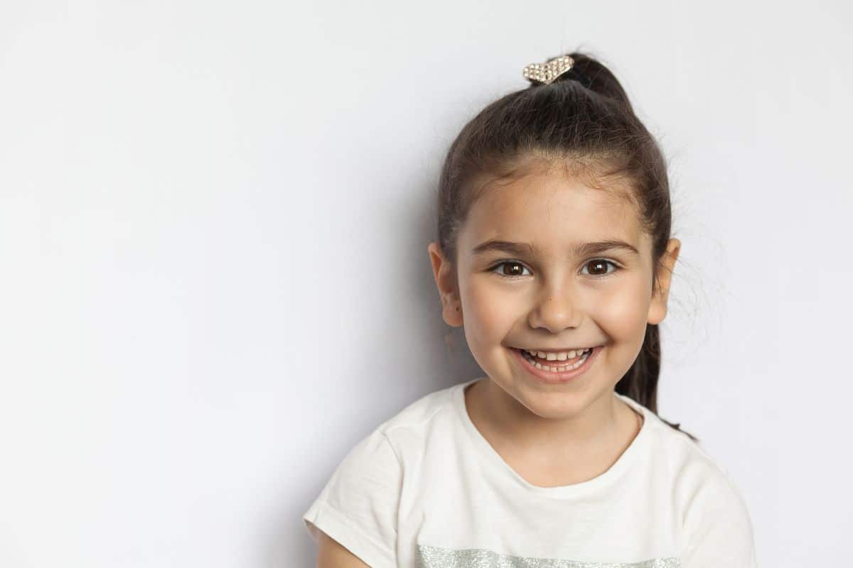 Little girl smiling happily applause and patient testimonials