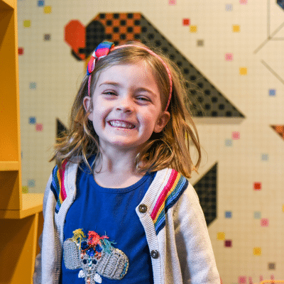Is teeth grinding in children normal? 2 Little girl smiling big at rva pediatric dentistry, representing how to stop teeth grinding in children